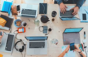 How USA-Based UI/UX Designers are Redefining Digital Interactions laptops on the table